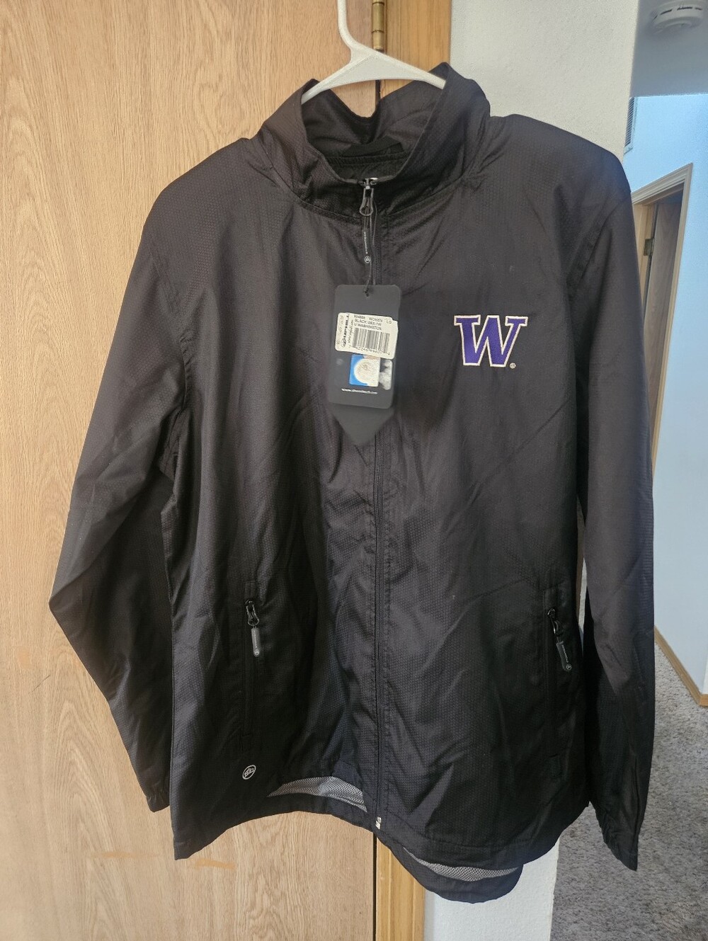Storm Black Womans Windbreaker Jacket with Purple 'W' Chest Logo